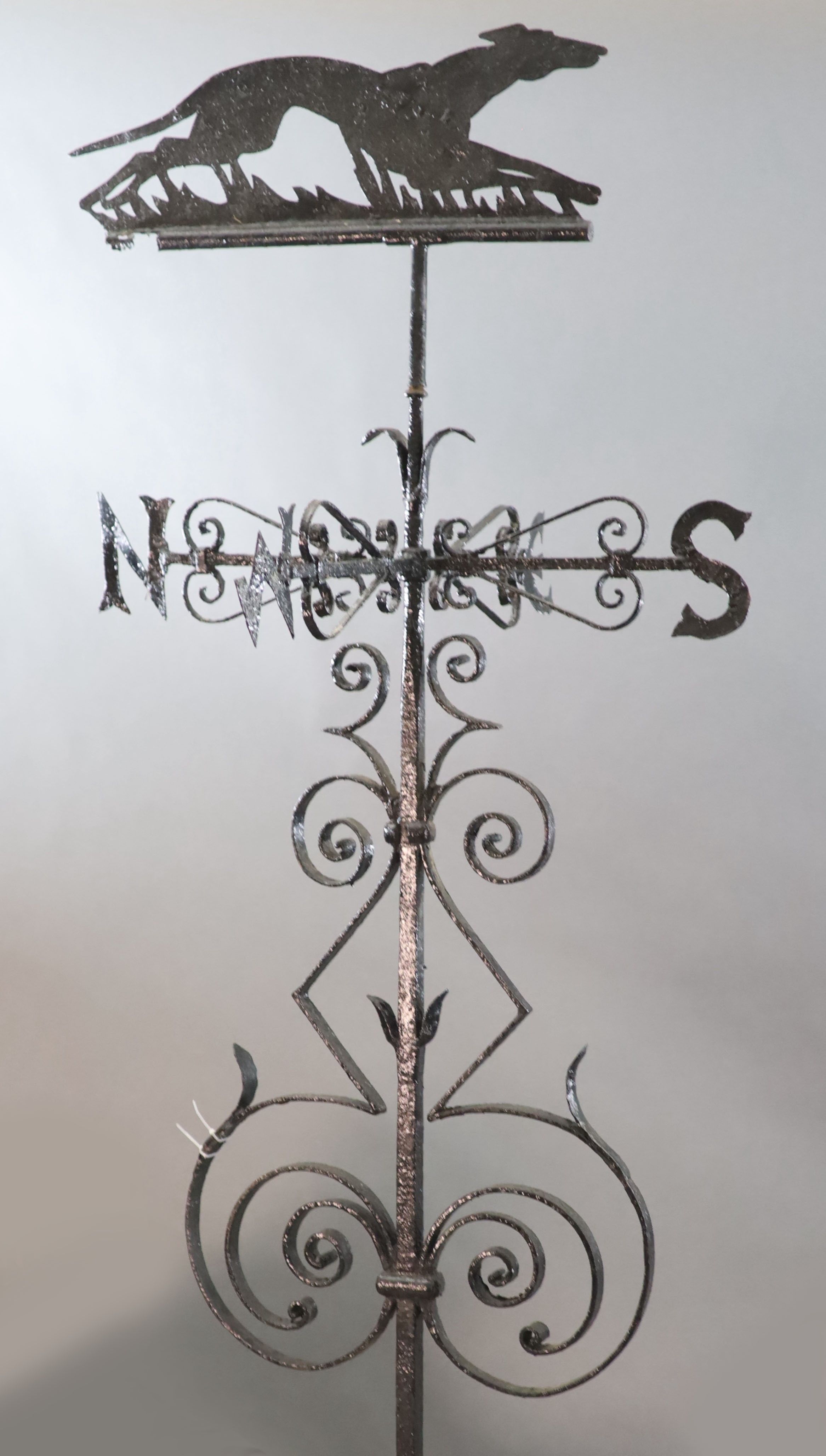 A large Victorian black painted wrought iron weather vane, H.8ft 4in.